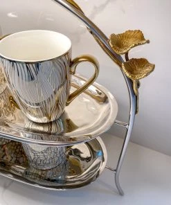 Inspire Me! Home Decor Two-Tiered Silver Stand With Gold Floral Details