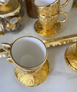 Inspire Me! Home Decor Gold Textured Metal Tea Cup And Saucer With White Interior